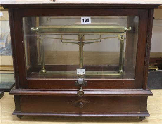 A set of mahogany cased brass beam scales